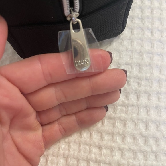 Dior black “CD” raised emblem silver & pearl wristlet & carriage keychain
